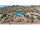 Aerial view of a house under construction, showcasing its unique design and surrounding landscape at 9609 N Palisades Blvd, Fountain Hills, AZ 85268