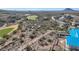 Aerial view showcasing a modern home under construction with stunning mountain and golf course views at 9609 N Palisades Blvd, Fountain Hills, AZ 85268