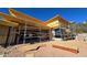 Exterior view of a modern house under construction with scaffolding and plywood at 9609 N Palisades Blvd, Fountain Hills, AZ 85268