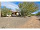 Home exterior showcasing desert landscaping and a gravel pathway at 13199 W Baker Dr, Peoria, AZ 85383