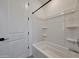 White shower and bathtub featuring modern finishes in an illuminated space at 17316 W Via Dona Rd, Surprise, AZ 85387