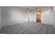 Spacious bedroom with neutral carpeting, ensuite bathroom, and ample natural light at 17316 W Via Dona Rd, Surprise, AZ 85387
