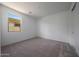 Bedroom featuring carpet, white walls, a closet, and natural light at 17316 W Via Dona Rd, Surprise, AZ 85387