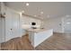 Bright kitchen featuring a spacious island, modern appliances, and stylish cabinetry at 17316 W Via Dona Rd, Surprise, AZ 85387