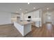 Well-lit kitchen featuring a spacious island and modern white cabinetry at 17316 W Via Dona Rd, Surprise, AZ 85387