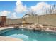 Relaxing kidney shaped pool with a stone waterfall feature at 19805 N 44Th Dr, Glendale, AZ 85308