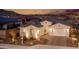 Luxury home with a spacious backyard, pool and landscape lighting at 2453 N 211Th Ln, Buckeye, AZ 85396