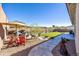 Backyard with patio furniture and artificial turf at 2453 N 211Th Ln, Buckeye, AZ 85396