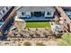 Artificial turf backyard with patio and umbrellas at 2453 N 211Th Ln, Buckeye, AZ 85396
