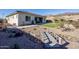 Backyard with artificial turf and a wooden bridge at 2453 N 211Th Ln, Buckeye, AZ 85396