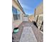 Backyard with storage shed, paved pathway, and decorative accents at 2453 N 211Th Ln, Buckeye, AZ 85396