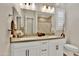 Bathroom with double vanity, large mirror, and shower at 2453 N 211Th Ln, Buckeye, AZ 85396