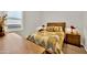 Bedroom with wood furniture and patterned bedding at 2453 N 211Th Ln, Buckeye, AZ 85396