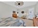 Bright bedroom with access to backyard and ceiling fan at 2453 N 211Th Ln, Buckeye, AZ 85396