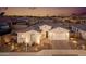 Stunning curb appeal featuring a two-car garage and desert landscaping at 2453 N 211Th Ln, Buckeye, AZ 85396