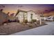 Front yard view with desert landscaping and seating area at 2453 N 211Th Ln, Buckeye, AZ 85396