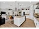Modern kitchen with large island, stainless steel appliances, and breakfast bar at 2453 N 211Th Ln, Buckeye, AZ 85396