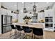 Modern kitchen with island, stainless steel appliances, and ample counter space at 2453 N 211Th Ln, Buckeye, AZ 85396