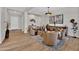 Open living room with high ceilings and wood floors at 2453 N 211Th Ln, Buckeye, AZ 85396