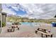 Community pool with picnic tables and mountain views at 2453 N 211Th Ln, Buckeye, AZ 85396