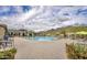 Community pool with seating and umbrellas at 2453 N 211Th Ln, Buckeye, AZ 85396