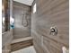 Clean shower with built-in seat and tiled walls at 2453 N 211Th Ln, Buckeye, AZ 85396