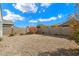 Spacious backyard with gravel and desert landscaping at 41369 W Crane Dr, Maricopa, AZ 85138