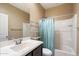 Bathroom with a bathtub, shower, and a metal shelving unit at 41369 W Crane Dr, Maricopa, AZ 85138