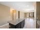 Kitchen with dark cabinets, granite island, and stainless steel appliances at 41369 W Crane Dr, Maricopa, AZ 85138
