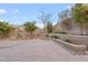 Paver patio surrounded by desert landscaping and a block fence providing a private outdoor retreat at 5531 W Gwen St, Laveen, AZ 85339