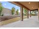 Covered patio overlooks the meticulously landscaped backyard, perfect for relaxation and entertainment at 5531 W Gwen St, Laveen, AZ 85339