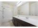 Bright bathroom featuring double sinks and a shower-tub combo at 5531 W Gwen St, Laveen, AZ 85339