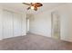 Bright bedroom with carpet, closet and attached bathroom at 5531 W Gwen St, Laveen, AZ 85339