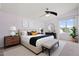 Bright bedroom features neutral decor, natural lighting, and a ceiling fan at 5531 W Gwen St, Laveen, AZ 85339