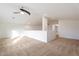 Bright bonus room features neutral carpet, a ceiling fan, and ample natural light, creating a versatile living space at 5531 W Gwen St, Laveen, AZ 85339
