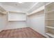 Walk-in closet featuring wood shelving and ample space at 5531 W Gwen St, Laveen, AZ 85339