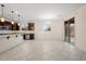 Spacious kitchen with granite counters and stainless appliances flows into the dining area with backyard access at 5531 W Gwen St, Laveen, AZ 85339