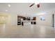 Spacious kitchen with granite counters and stainless appliances flows into the dining and living areas at 5531 W Gwen St, Laveen, AZ 85339