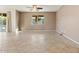 Open living room with tile floors, neutral walls, and natural light from sliding glass doors at 5531 W Gwen St, Laveen, AZ 85339