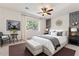 The main bedroom features a decorative accent wall, ambient lighting, and neutral decor at 5531 W Gwen St, Laveen, AZ 85339