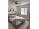 Comfortable bedroom featuring a cozy bed, neutral tones, and natural light streaming through the window at 2112 N 24Th Pl, Phoenix, AZ 85008