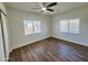 Bright bedroom with wood floors, ceiling fan, and ample closet space at 2112 N 24Th Pl, Phoenix, AZ 85008