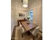 Cozy dining room featuring modern lighting, a wood table and a stylish sideboard at 2112 N 24Th Pl, Phoenix, AZ 85008