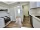 Updated kitchen, white cabinets, stainless steel appliances, and quartz countertops at 2112 N 24Th Pl, Phoenix, AZ 85008