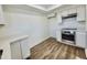 Modern kitchen with stainless steel appliances and white cabinets at 2112 N 24Th Pl, Phoenix, AZ 85008