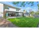Contemporary backyard oasis with expansive lawn and covered patio at 221 E 14Th St, Tempe, AZ 85281