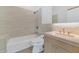Clean bathroom with a bathtub, toilet and light wood vanity at 221 E 14Th St, Tempe, AZ 85281