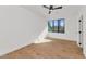 Bright bedroom with large window, wood floors and ceiling fan at 221 E 14Th St, Tempe, AZ 85281