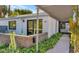 Modern home exterior with covered walkway and lush landscaping at 221 E 14Th St, Tempe, AZ 85281