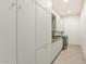 Bright laundry room with modern cabinetry and tile floors at 221 E 14Th St, Tempe, AZ 85281